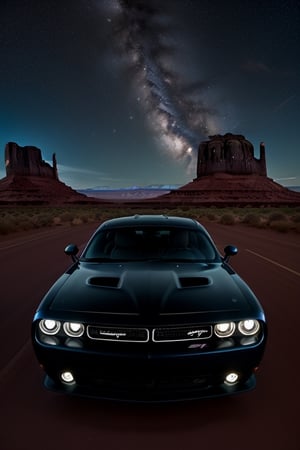 dodge challenger in monument valley in night with milky way